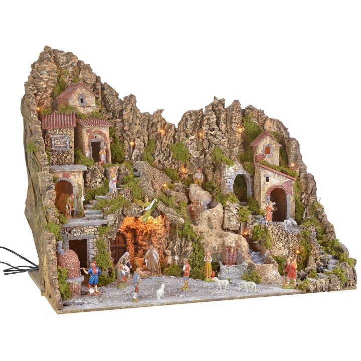 Illuminated nativity scene with a grotto, fountain, waterfall