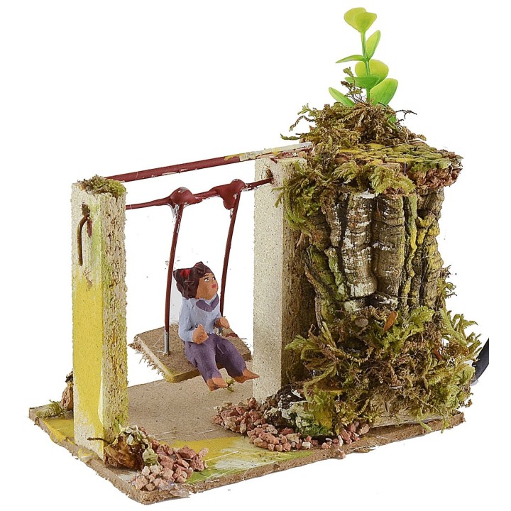 Niño en el columpio serie 10 cm en movimiento