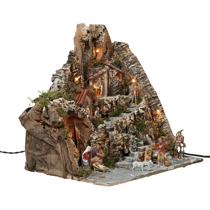 Presepe illuminato con fontana funzionante e completo di statue