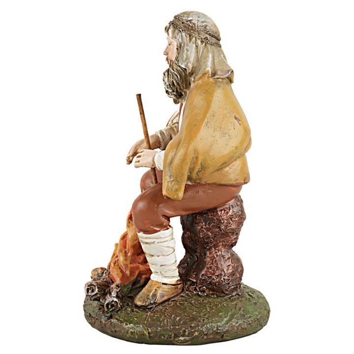 Shepherd sitting in front of the fire series 10 cm in resin