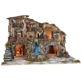 Illuminated nativity scene with waterfall, fountain, and
