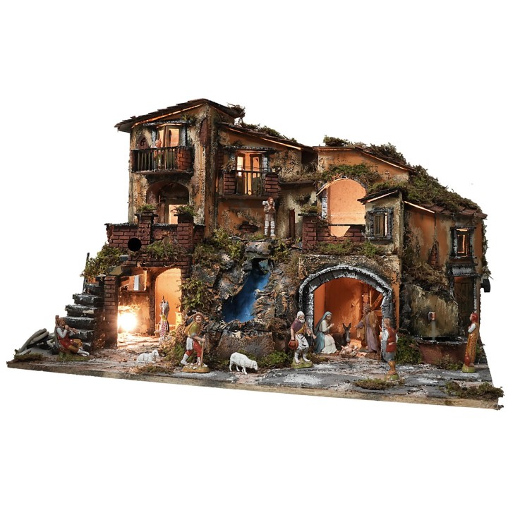 Illuminated nativity scene complete with statues, waterfall