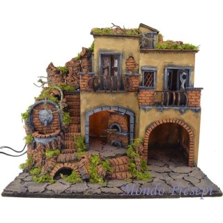 The crib with the village lit up with a fountain and oven 50x40