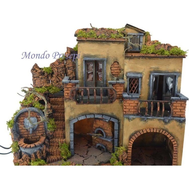 The crib with the village lit up with a fountain and oven 50x40