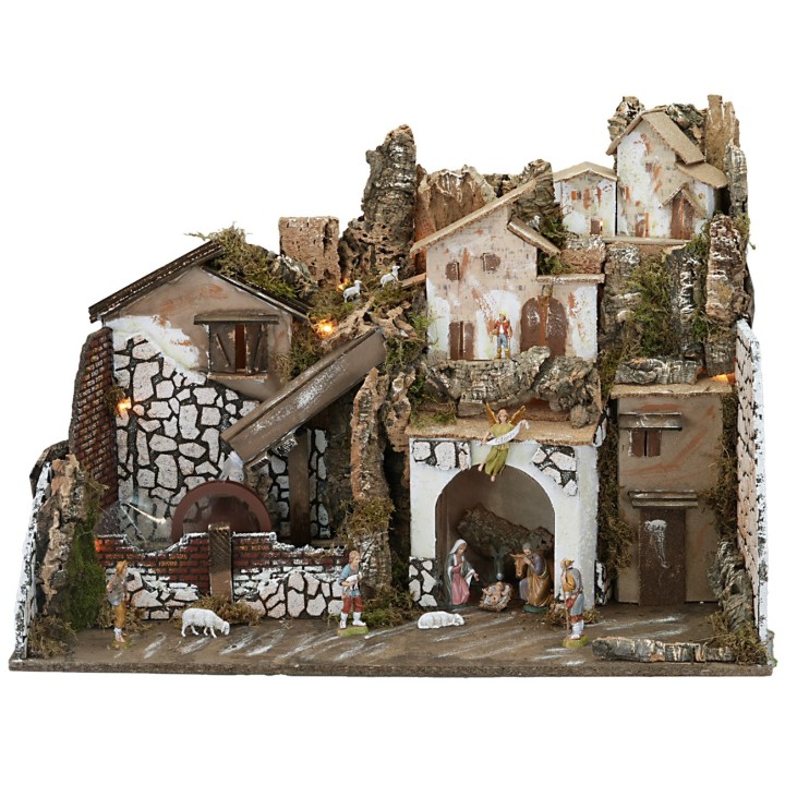 Nativity scene with statues illuminated with a mill complete