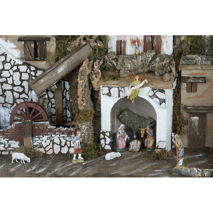 Nativity scene with statues illuminated with a mill complete