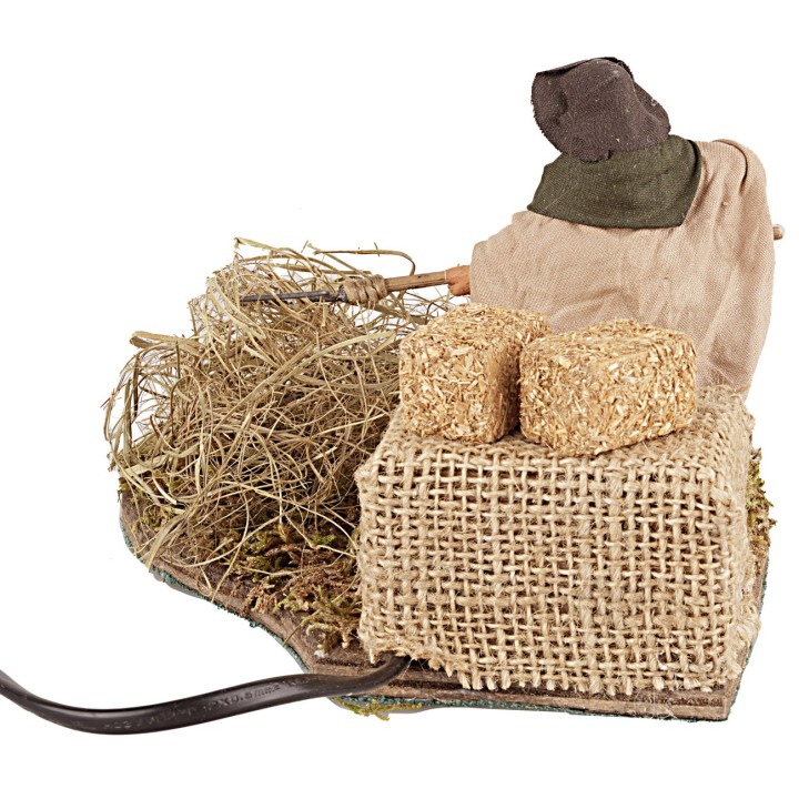 Peasant woman spreading straw in motion, 10 cm