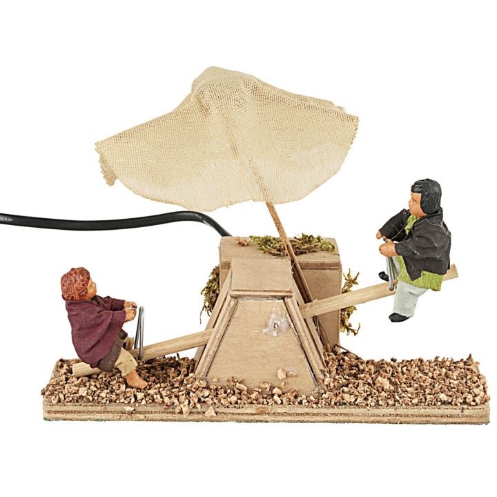 Children on the swing in motion 12 cm