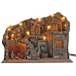Illuminated nativity scene with working windmill and fountain