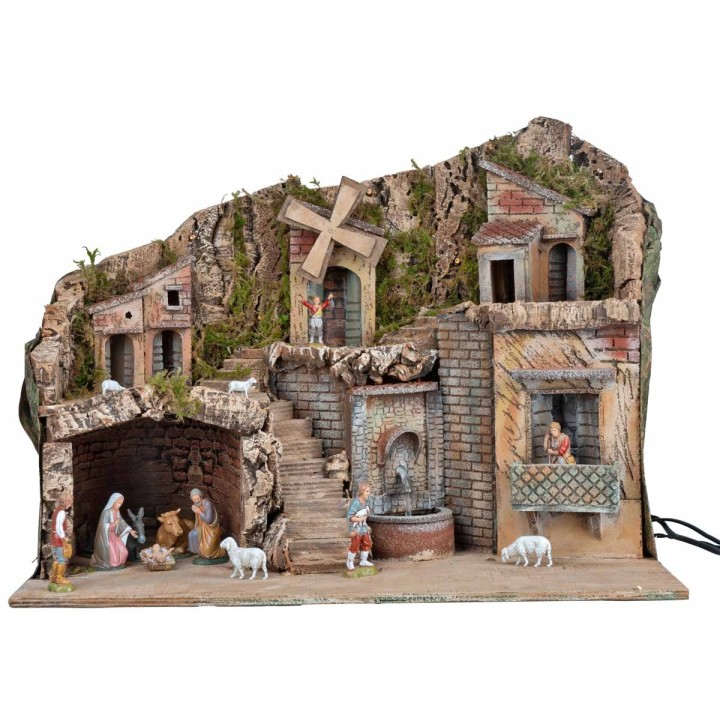 Illuminated nativity scene with working windmill and fountain