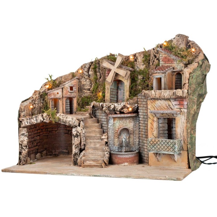 Illuminated nativity scene with a windmill and fountain powered