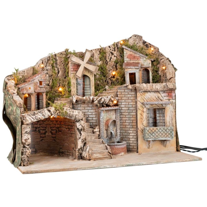Illuminated nativity scene with a windmill and fountain powered