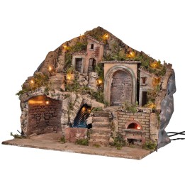 Illuminated nativity scene with oven and waterfall powered by