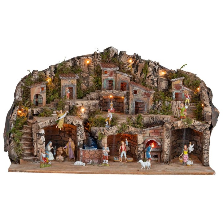 Pesebre iluminado con cuevas, casitas, arroyo y horno funcional