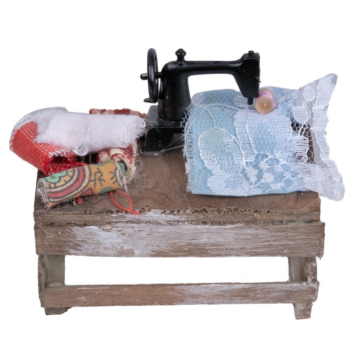 Seamstress table with machine and fabrics