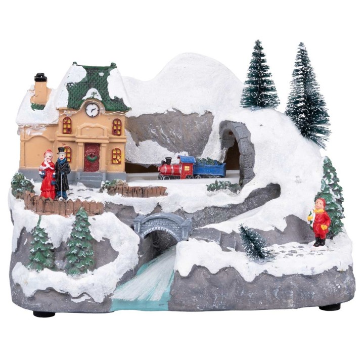 Pueblo navideño con tren en movimiento equipado con luces y
