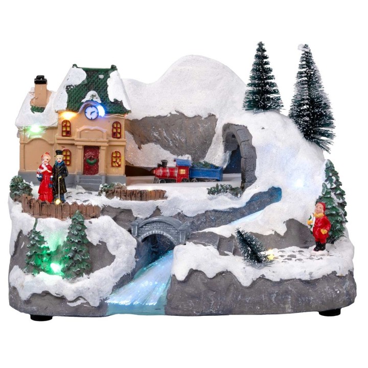 Pueblo navideño con tren en movimiento equipado con luces y