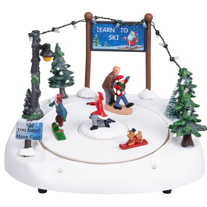 Ice rink with moving skiers complete with lights and music