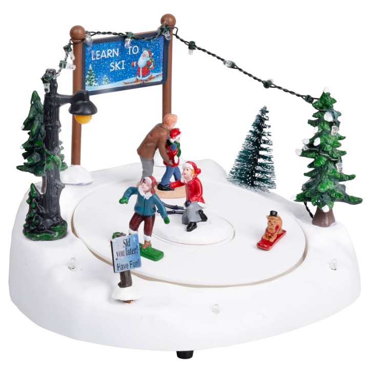 Ice rink with moving skiers complete with lights and music
