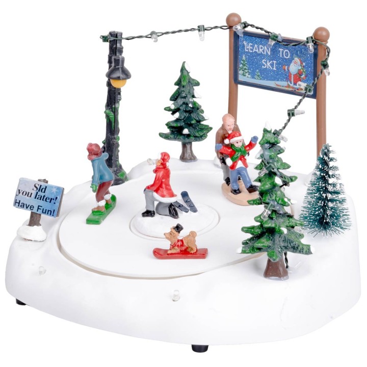 Ice rink with moving skiers complete with lights and music