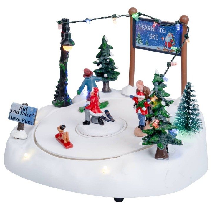 Ice rink with moving skiers complete with lights and music