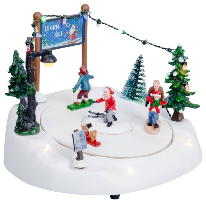 Ice rink with moving skiers complete with lights and music