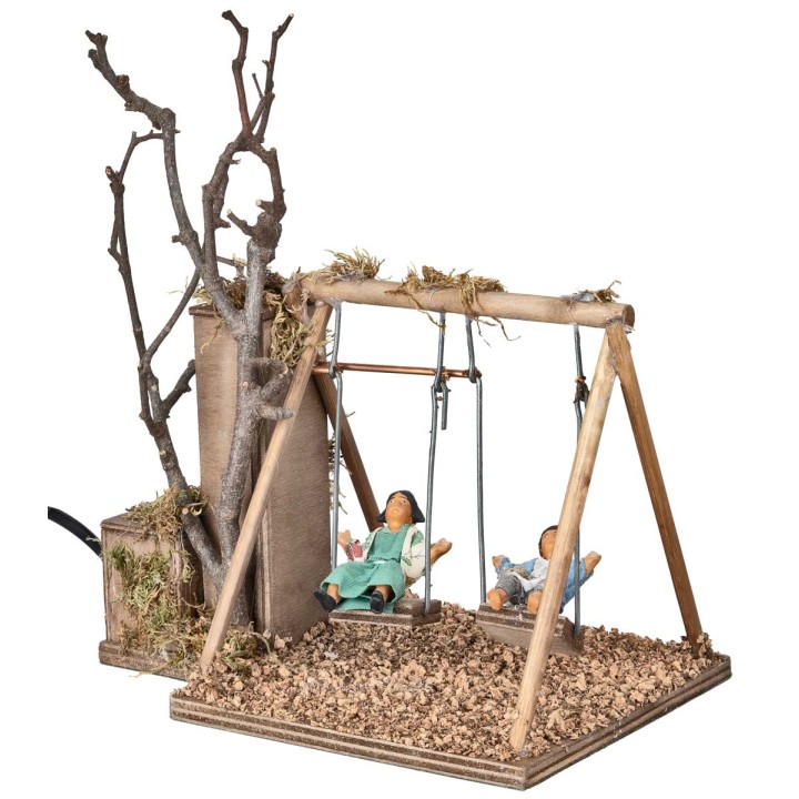 Pareja de niños en columpio serie 12 cm en movimiento