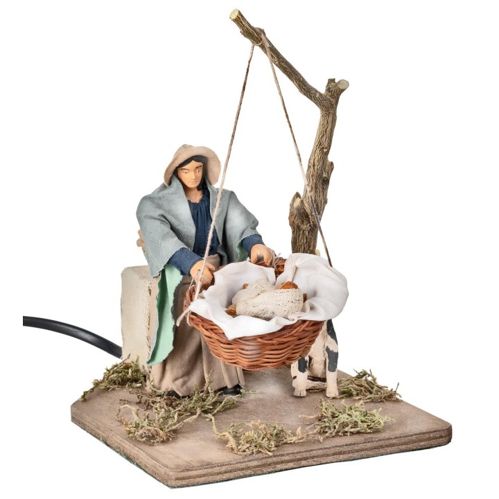 Mother with child in basket in motion 12 cm