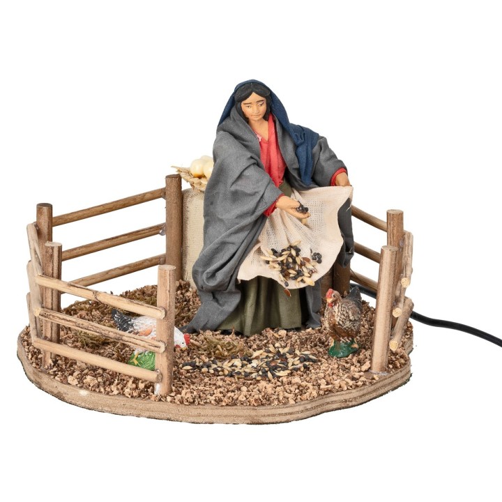 Farmer woman feeding chickens in motion 12 cm