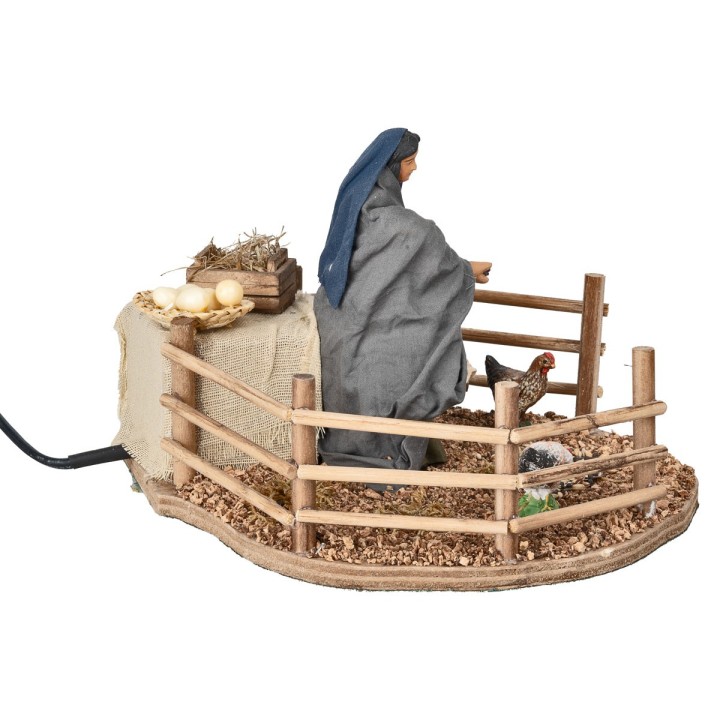 Farmer woman feeding chickens in motion 12 cm