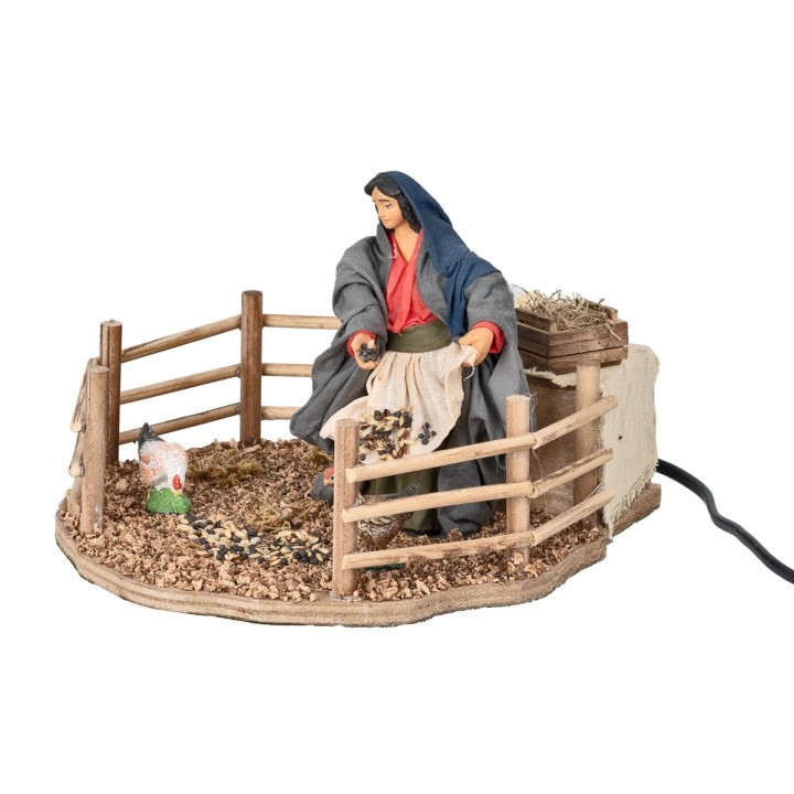 Contadina che ciba le galline in movimento 12 cm
