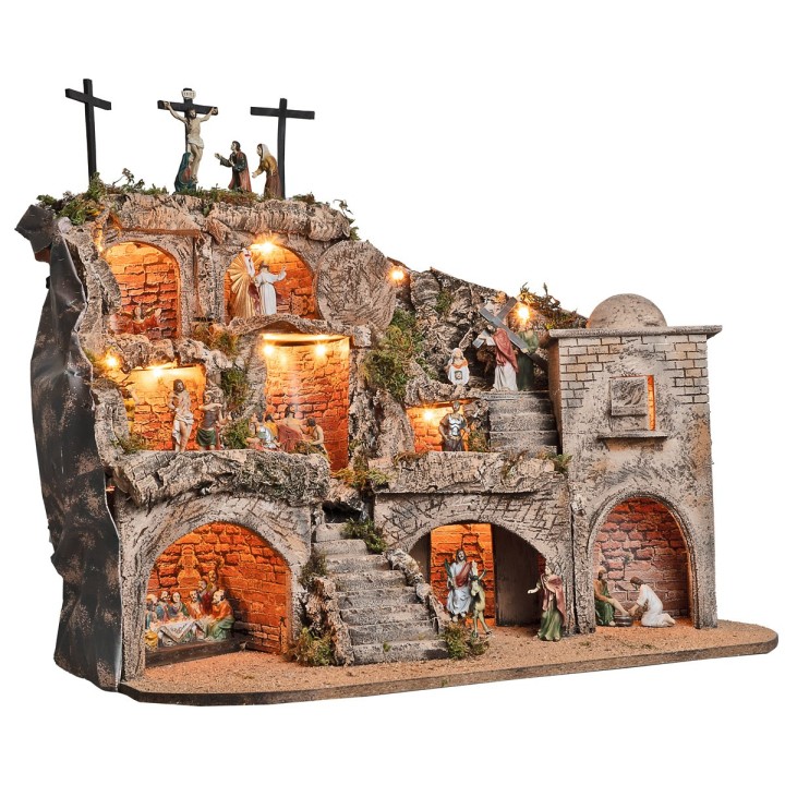 Illuminated Easter nativity scene complete with statues with