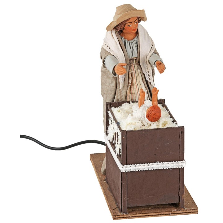 Mamá con niño en la cuna en movimiento 24 cm