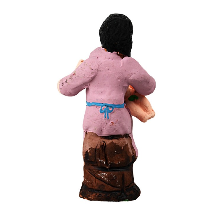 Seated woman breastfeeding a child from the 10 cm painted