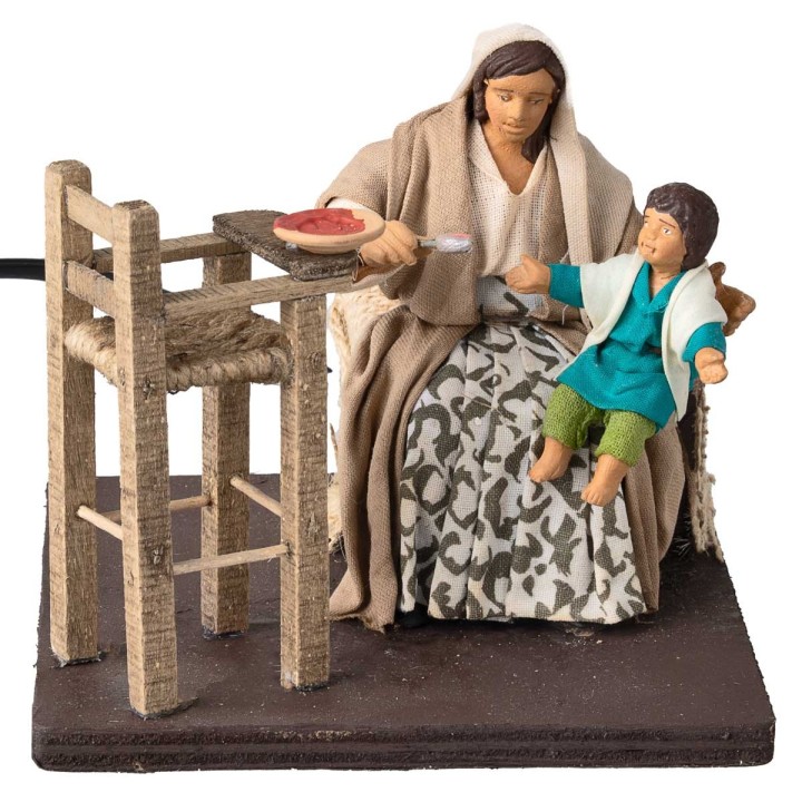 Mother feeding the child series 12 cm in motion