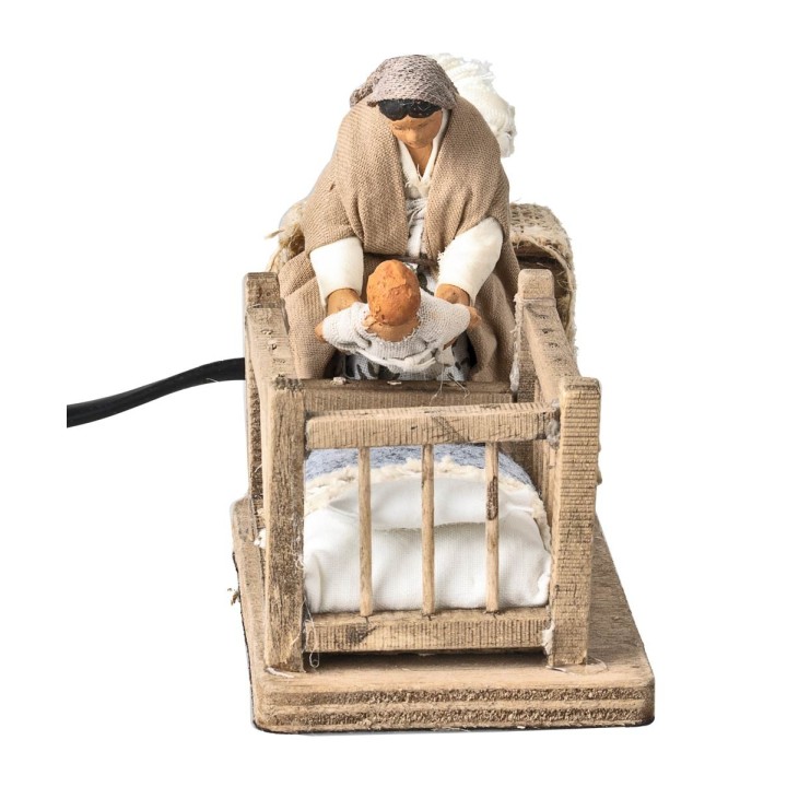 Mother taking child from cradle 10 cm in motion