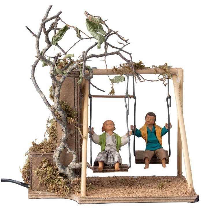 Pair of children on a swing cm 14 in motion
