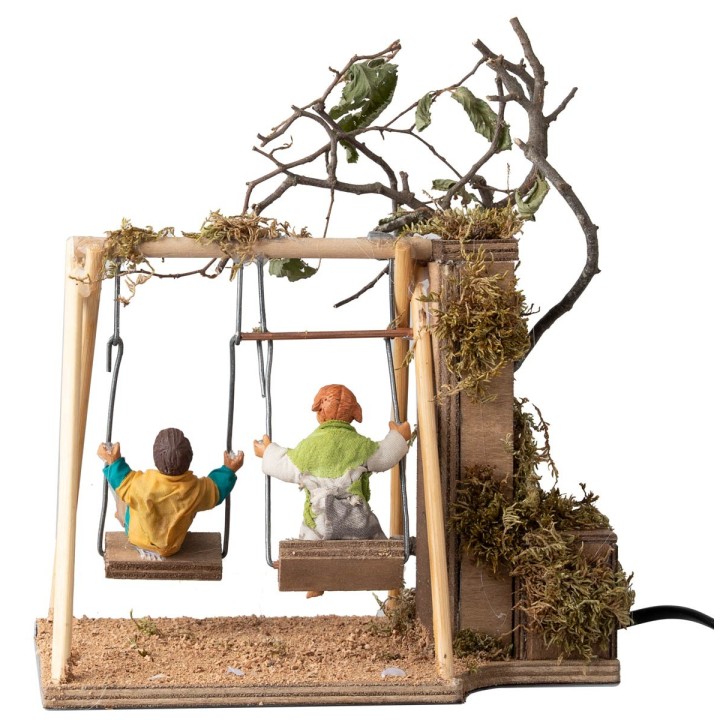 Pair of children on a swing cm 14 in motion