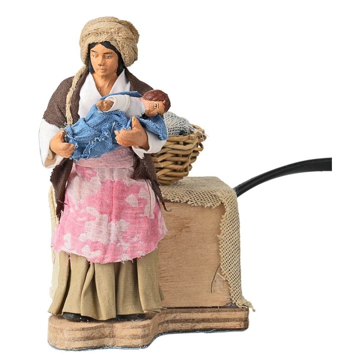 Mother cradling baby in arms cm 10 in motion