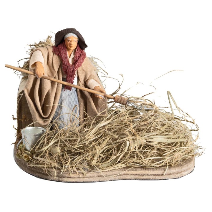 Peasant woman spreading hay 10 cm in motion