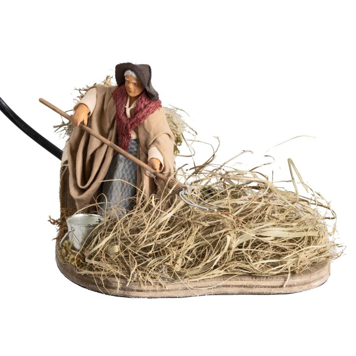 Peasant woman spreading hay 10 cm in motion