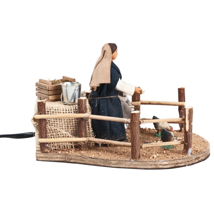 Woman feeding chickens 10 cm in motion