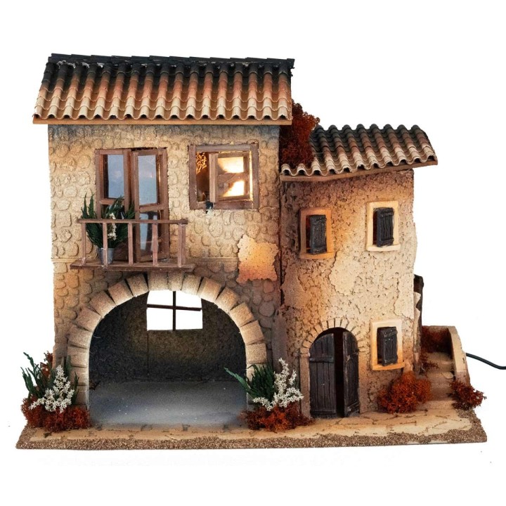 Illuminated village with moving woman cm 50x30x41.5 h