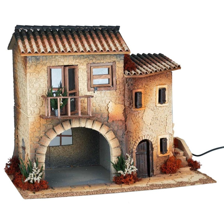 Illuminated village with moving woman cm 50x30x41.5 h
