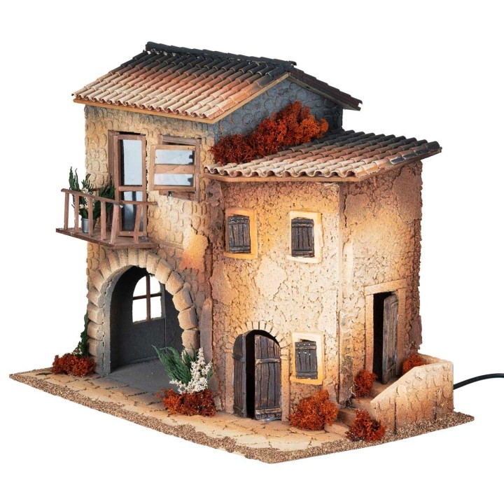 Illuminated village with moving woman cm 50x30x41.5 h