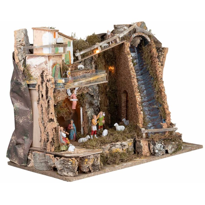 Illuminated nativity scene with steep waterfall and Landi