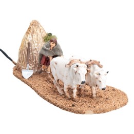 Farmer with oxen and plow in motion 10 cm
