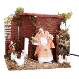 Contadina con galline 10 cm in movimento cm 17x14x14 h