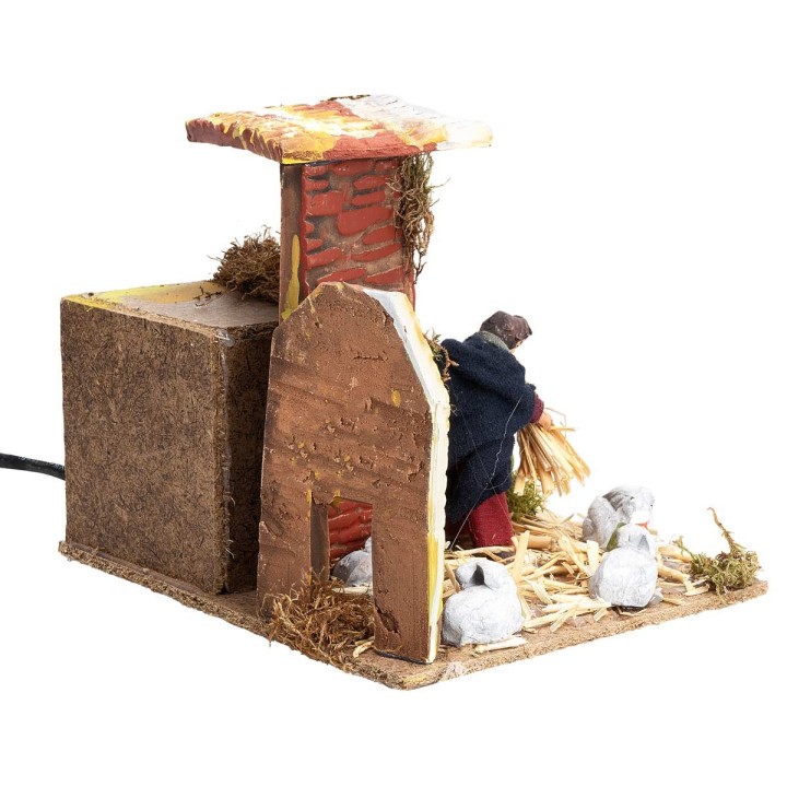 Campesino con conejos 7 cm en movimiento cm 17x14x14 h