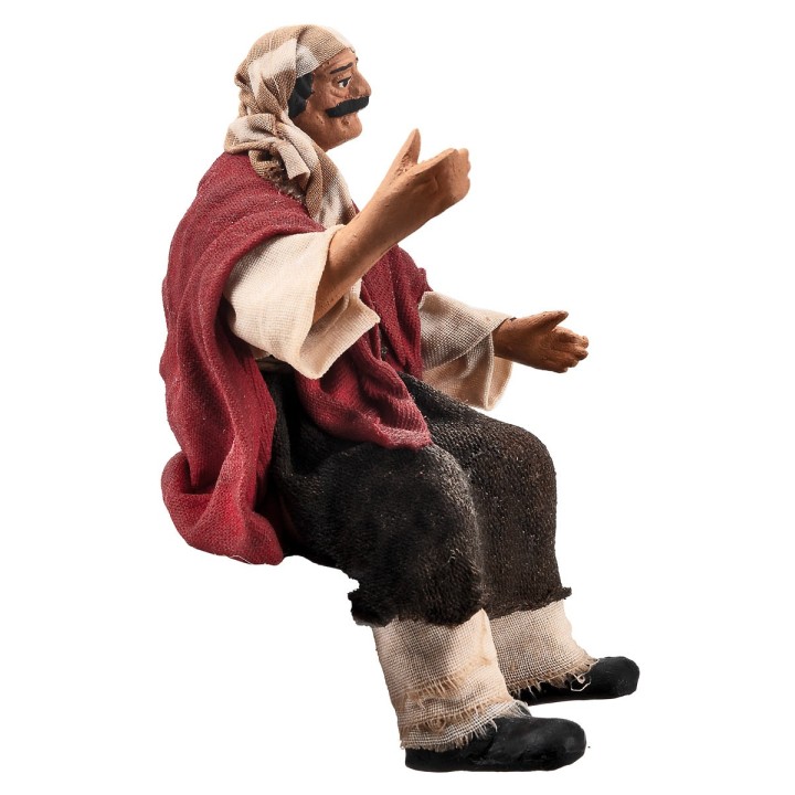 Seated farmer 15 cm series in terracotta with fabric clothes